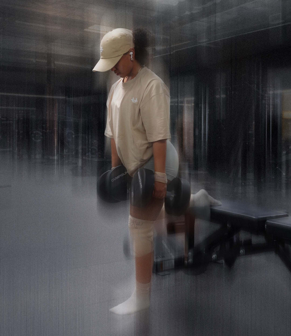 woman doing dumbbell leg exercises