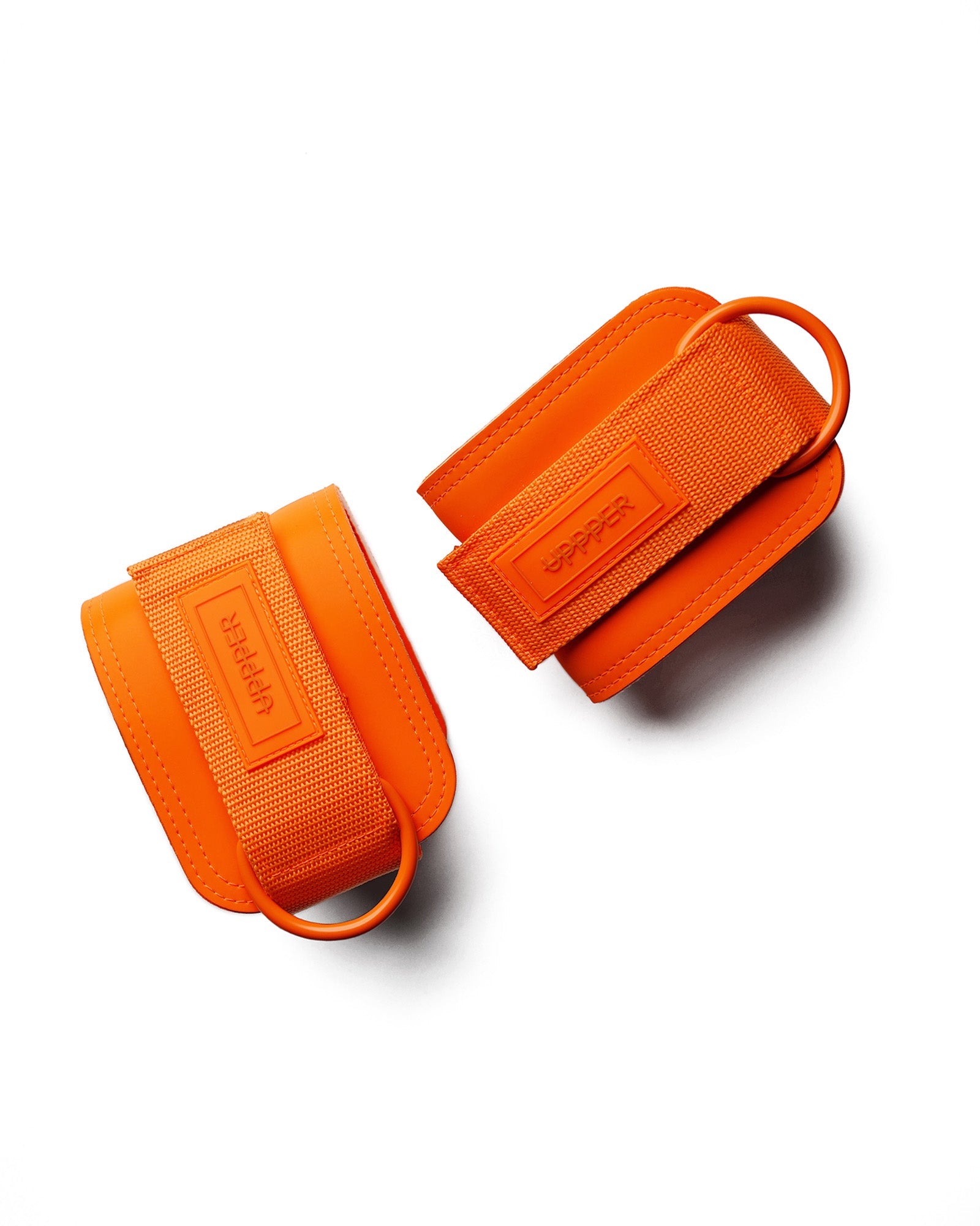 pair of neon orange uppper ankle straps with d-rings and velcro closure on white background